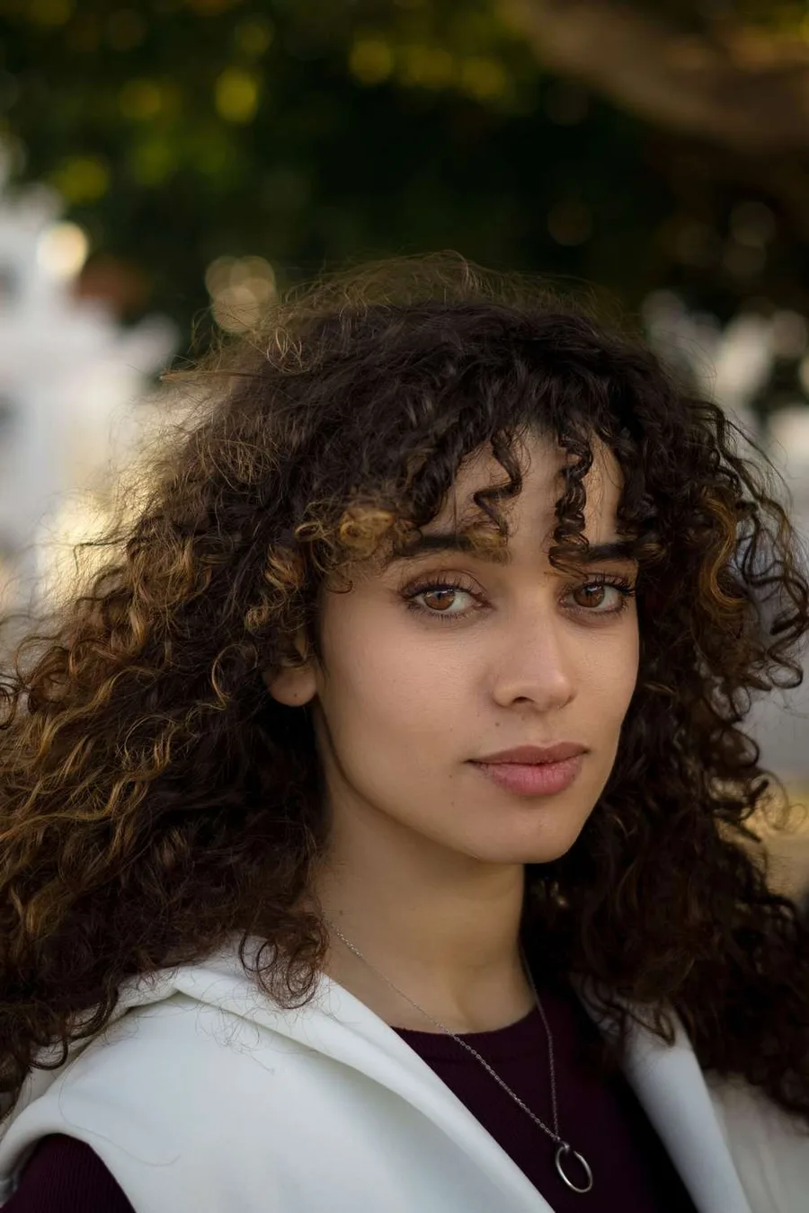 2. Curly butterfly with bangs