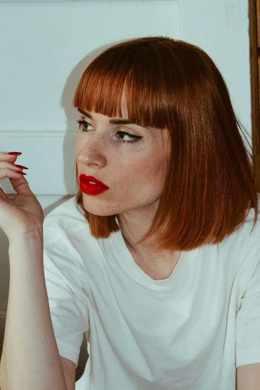 9. The copper French bob with a rounded fringe