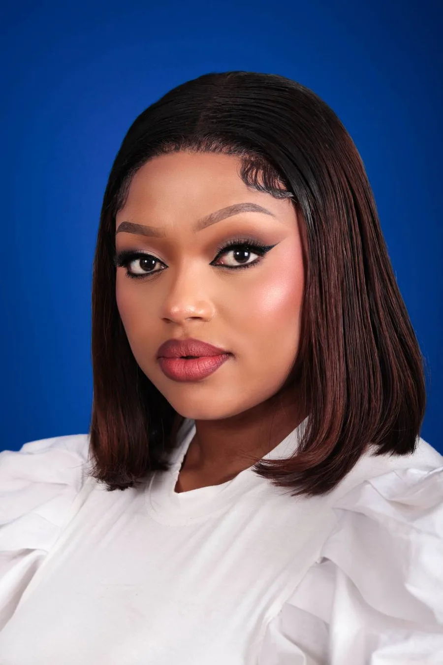 Sleek layered bob with long layers on straight hair